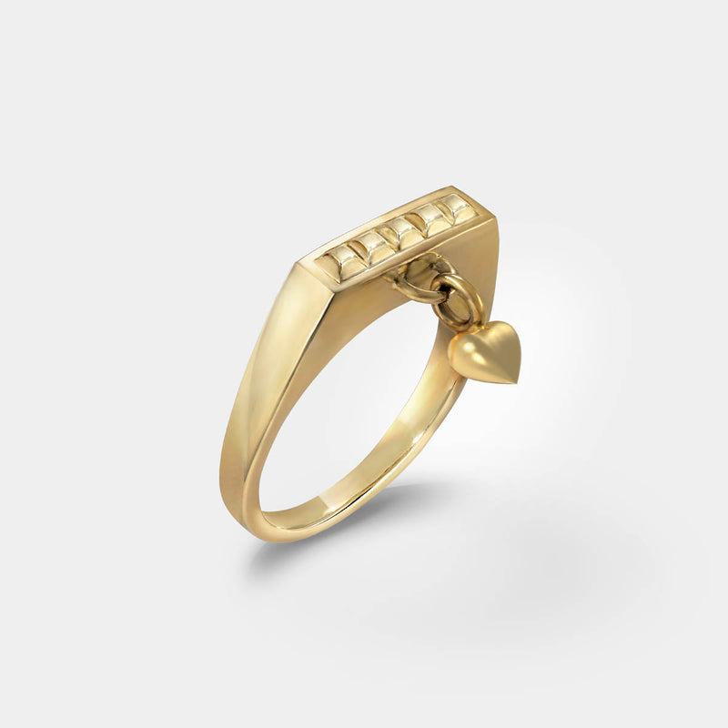 Charm heart ring – Sleek square design in gold with tiny studs and a heart dangle charm – Livva Østerby.