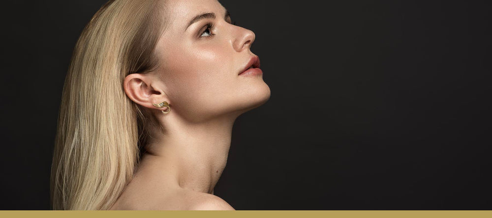 Ear climbers - Earring in gold with rivet and leave details shown on model - Olivia O'Nello collection