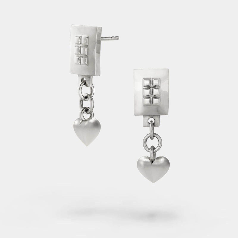 Heart drop earrings – A square design with tiny studs and a dangling heart in sterling silver – Livva Østerby.