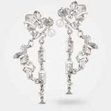 Silver floral earrings – Pair of organic jewellery in sterling silver, with surreal leaves, chains, and a white pearl – Livva