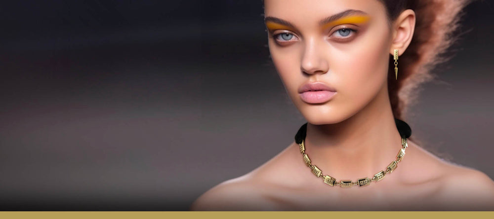 Square jewellery - Spike earrings gold & square chain necklace in gold with black satin ribbon on posh model widescreen – Livva Østerby.