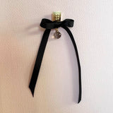 Gold square earrings – Square design with tiny studs & elegant smoky quartz gemstone dangle with black satin bow – Livva Østerby.