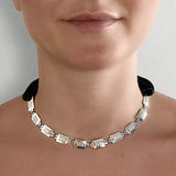Square link chain necklace – Chunky silver with tiny studs & elegant black satin ribbon closure on model – Livva Østerby.