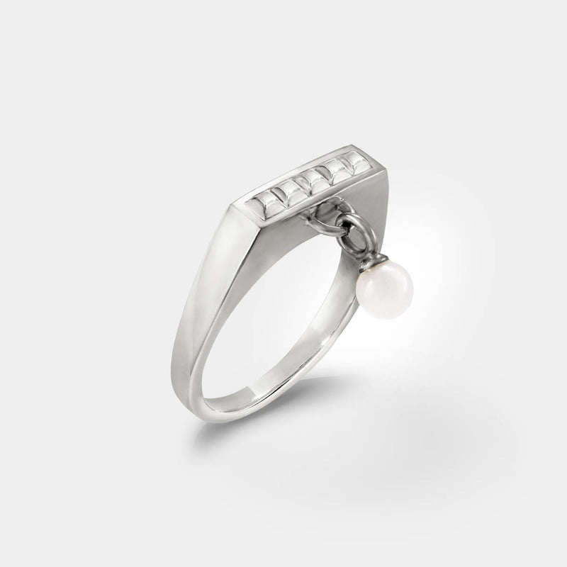 Square silver ring – Sleek square design with tiny studs & a snow quartz dangle charm – Livva Østerby.