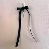 Spike earrings silver – A sleek square design with tiny studs, a dangling spike, and black satin bow – Livva Østerby.