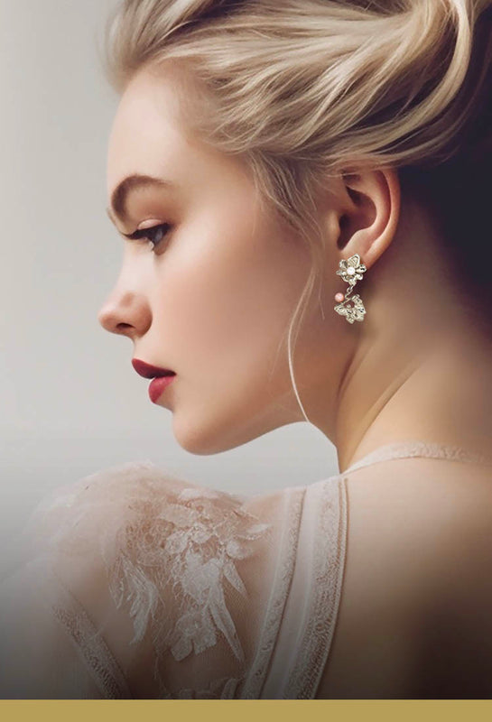 Sterling silver jewellery – A flower drop earring in bright light silver with 2 pearls on model showing Scandinavian luxury.