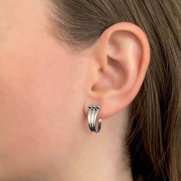 Triple-hoop earrings – 3 simple hoops in one - Cool sterling silver with black diamonds - Skylar Sway collection on model.