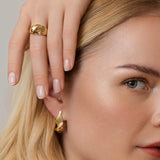 Twisted gold ring & earring – an innovative sculptural twist of a classic look - Grace York collection on model.