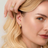 V Ring Gold – Ring shaped like a V in 18k gold with 3 white diamonds and matching earrings on model – Skylar Sway collection.