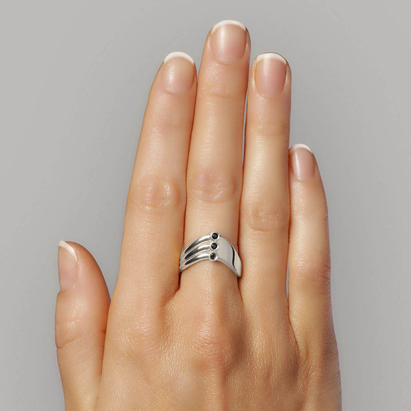 V Ring - shaped like a V in sterling silver with 2 sides divided by 3 black diamonds shown on model – Skylar Sway collection.