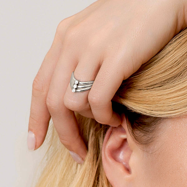 V-Ring - shaped like a V in sterling silver with 2 sides divided by 3 white diamonds shown on model – Skylar Sway collection.