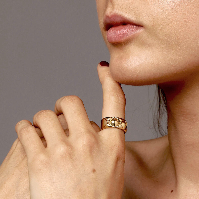 Wide ring gold  - Sculptural Danish jewellery design where straight design meets quilted organic top, on model – Livva